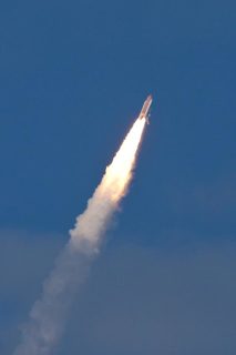 Space Shuttle Atlantis (STS-129) clears the clouds on it's way to the International Space Station.