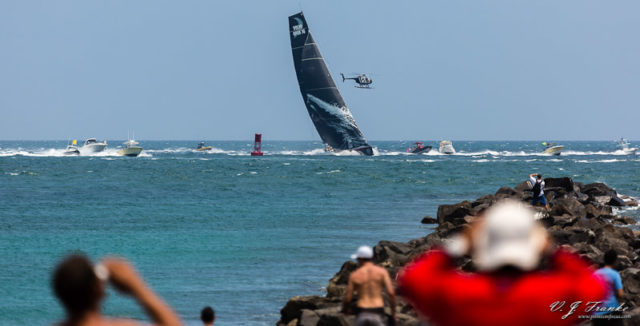 Spectators watch Mar Mostro at South Pointe Park Puma Ocean Racing's entrant in the 2011-2012 Volvo Ocean Race, Mar Mostro (Monster of the Sea), sails with the spectator fleet after winning Leg 6 (Itajai, Brazil to Miami, FL, United States). The Volvo Ocean Race is a 39,000-mile, 10 month, regatta that circumnavigates the globe stopping briefly in ports around the world to replenish, race, and make repairs.