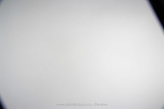 Lee holder on wide-angle adapter ring, mounted on a Canon EF-S 10-22mm f/3.5-4.5 USM @ 10mm, focused at infinity, with a standard thickness protection filter. The left side of frame shows 2-slot configuration, right side shows 3-slot configuration. Holder rotated approximately 30 degrees counter clockwise.