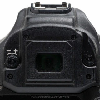 The EOS-1D series (1D mark III shown here), cover the diopteric adjustment completly with the eye-cup, and provide a lever actuated shutter to black out the viewfinder for long exposures.