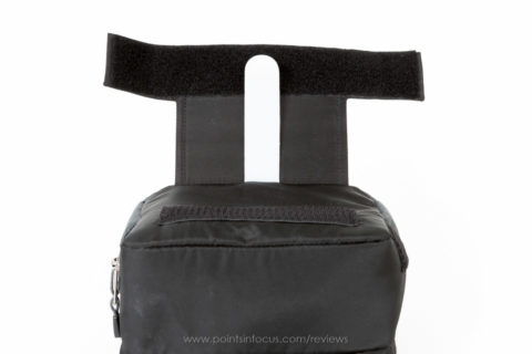 The working side of thinktank's belt pack system. the white plastic tongue can be used to locks pouch in position by padding it through webbing loops belt. note velcro on locking flap wraps around bottom bag for extra security.