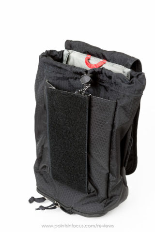 All of the skin pouches also have this inner secondary pocket under flap. it's secured shut by a small tab velcro (unseen) and runs full width front bag.