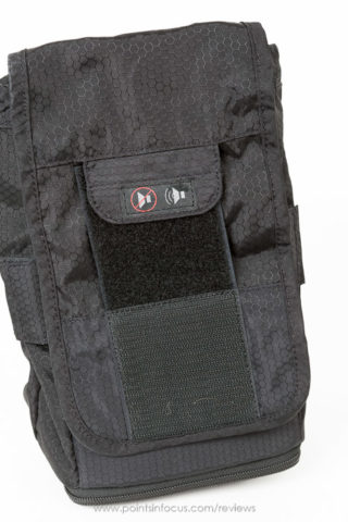 All of the skin series pouches use velcro to secure cover flap. in situations where sound being separated would be distracting, covers can silenced by flipping down silencer tab. you also partially close tab reduce noise but not completely eliminiate locking.